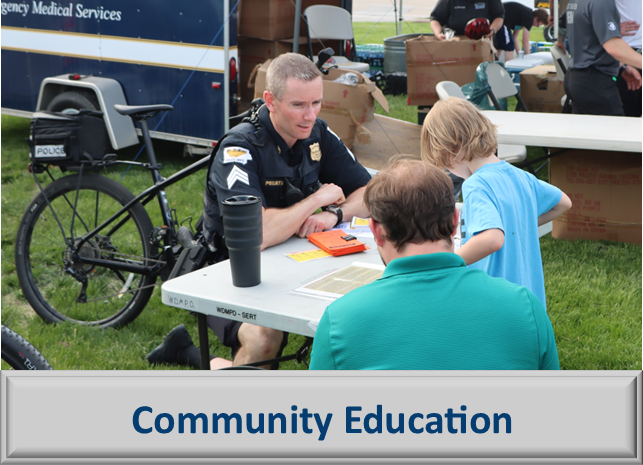 Bike patrol officer engaging with a child