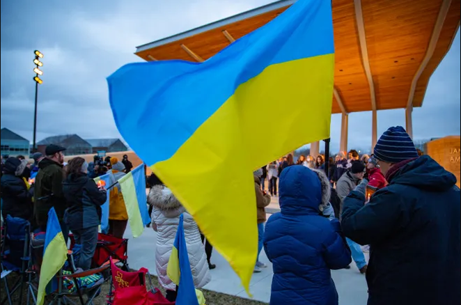 Crowd of people waiving Ukrainian flags