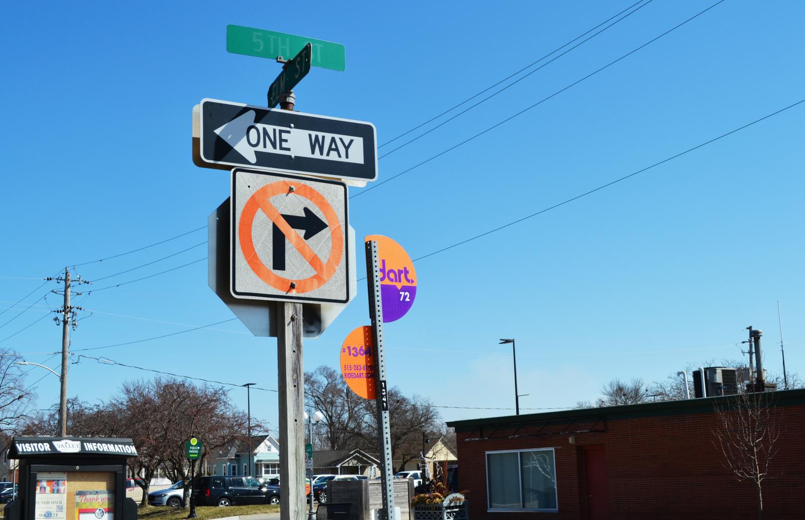 Photo of Dart Bus Stop Sign and a Stop Sign in Valley Junction