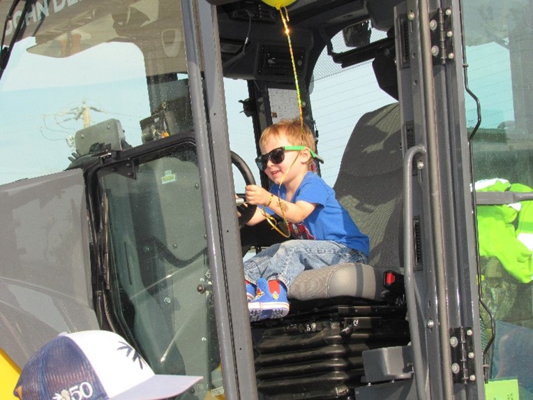 Child sitting in equipment