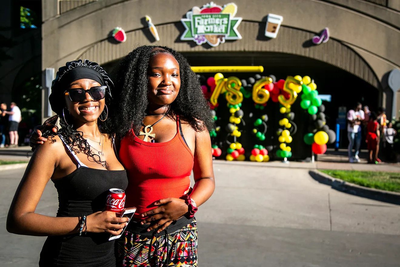 Angel McCambry, left, and NaÕilah Bakare pose for a photo during the Downtown at Sundown event hosted by the Johnson County Iowa Juneteenth Commemoration, Friday, June 17, 2022, at Chauncey Swan Park in Iowa City, Iowa.