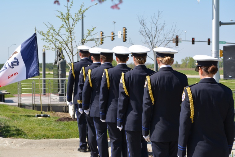 Honor guard facing memorial